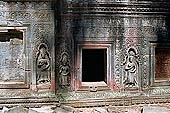 Ta Prohm temple - devatas sculpted on the gallery walls